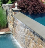 Trough for vanishing edge equipped with swim-in-place machine.