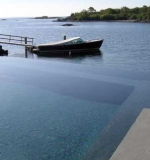 Vanishing edge 30' above the ocean. Interior bench seating and walk-in stairs.