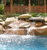 Small waterfall turns this freeform pool into a stunning focalpoint for the yard.
